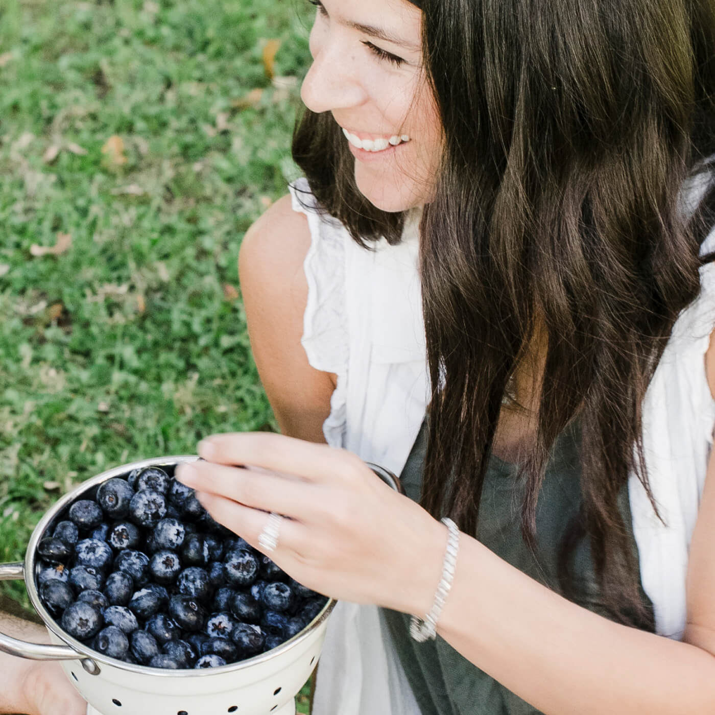 Image of person snacking on bluberries